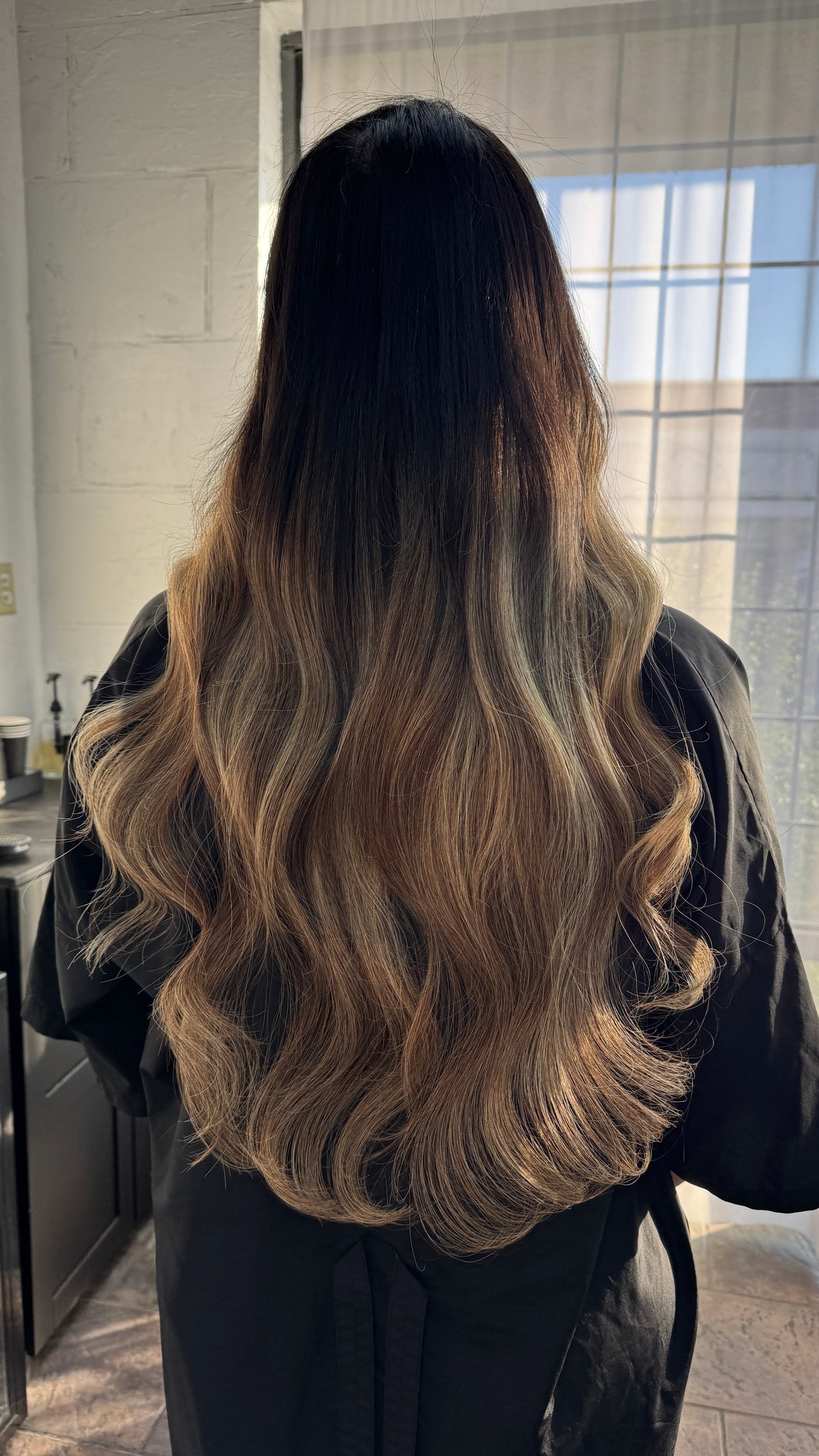 Dimensional long hair with softly blended waves at The Studio X